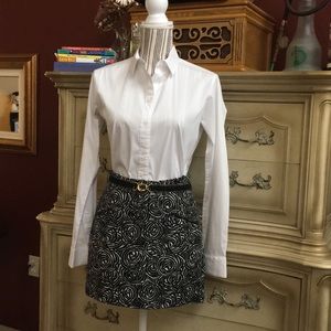 Vintage pattern mini skirt with match gold belt.